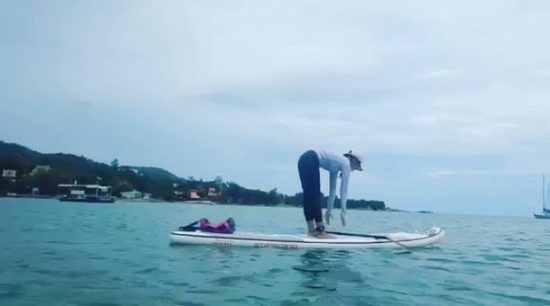 Practicing SUP Yoga