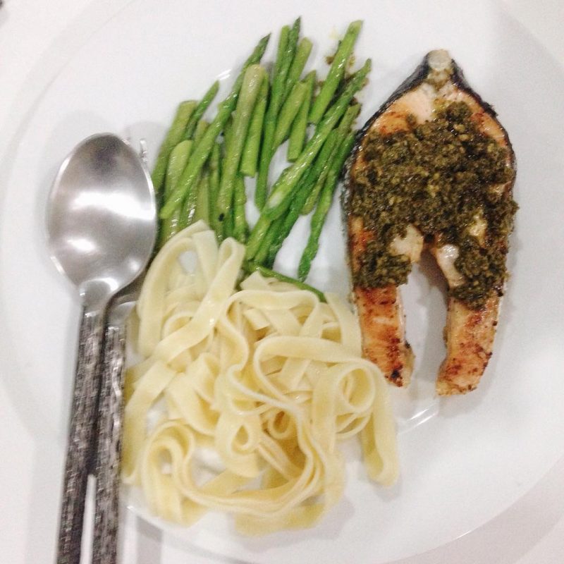 Grilled Salmon with presto sauce served with pasta and asparagus