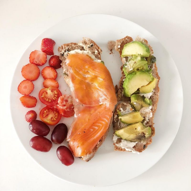 Breakfast at home: pepper salmon and avocado olive ciabatta with cherry tomatoes 🍅, strawberries and grapes