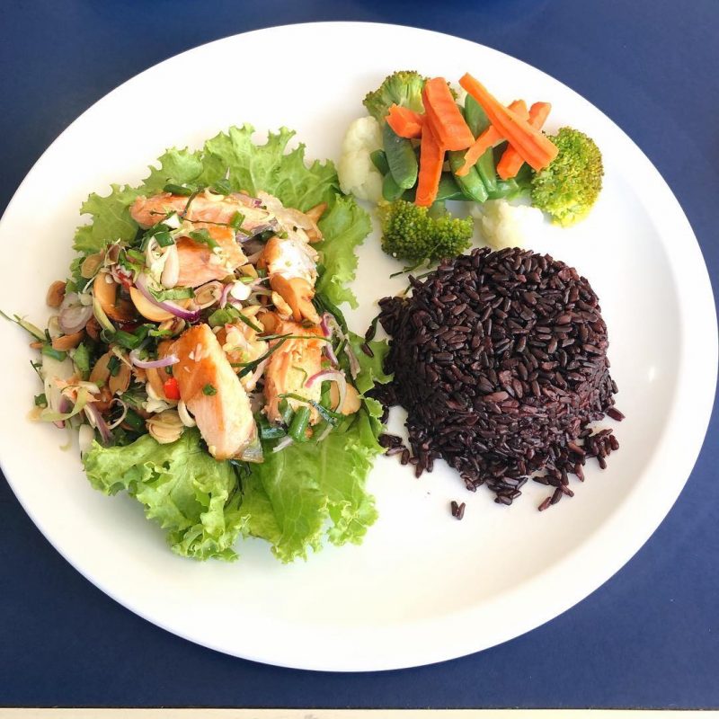 Yummy spicy salmon salad with rice berry and power (Buddha) bowl at Coffee cup Bangrak